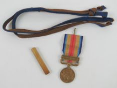 A WWII Japanese China incident campaign medal together with a WWII Japanese sword knot.