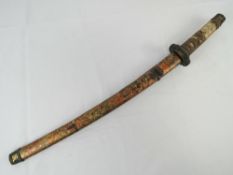 A Japanese Katana, no apparent markings to blade, having unknown markings to tsuba,