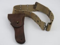 A WWII Colt 1911 holster and belt.