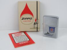 A USS Talbot FFG-4 'Determined' Zippo lighter 'as new' in box.