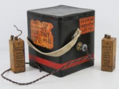An inert training TNT demolition box together with two British Army batteries.