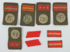A quantity of WWII Japanese cloth rank slides. Seven items.