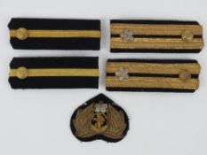A WWII Japanese Navy Rank slides and badge.