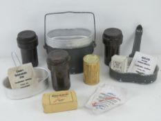 Two WWII German mess tins with rations/accessories,