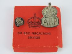 A HM silver ARP lapel badge, hallmarked for London,