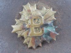 A WWII US helmet and a French helmet, both having liner and chin strap.