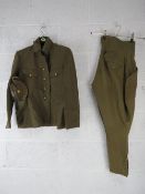 A WWII Japanese Army uniform comprising cap, trousers, and tunic with buttons.