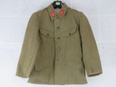 A WWII Japanese Army Private's 1st Class jacket, bearing Japanese writing within.