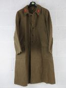 A WWII Japanese Army Superior Private's Great Coat, dated 1943 and bearing Japanese writing within.