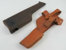 A reproduction Mauser C96 broom handle shoulder stock, with holster.