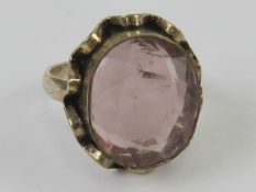 A rose quartz ring, stamped 925, quartz approx 16 x 9mm, size P.