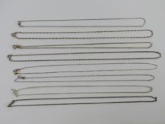 Eight silver chain necklaces of various