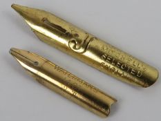 A 14ct gold Watermans fountain pen nib, together with a gilt metal nib. Two items.