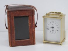 A vintage leatherette travel clock case