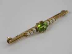 A 9ct gold peridot and seed pearl brooch