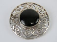 A large Celtic style silver and onyx plaid brooch, stamped 925, 4.8cm dia.