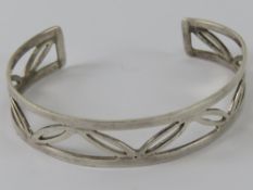 A HM silver bangle having open leaf patt