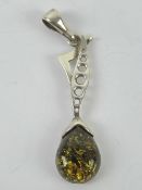 A large silver and green Baltic amber pe