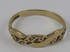 A 9ct gold ring having carved scrolling vine design, hallmarked Sheffield, size O-P, 1.5g.