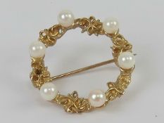 A gold and pearl wreath brooch, indistin