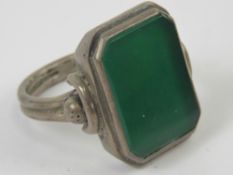 An Art Deco green onyx signet ring, unengraved, no apparent hallmarks, size U.