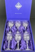 A set of six Edinburgh Crystal wine glasses in original box.
