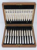 A fine set of Art Deco HM silver and mother of pearl handled fruit knives and forks for twelve