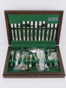 A silver plated cutlery set in original box by Oneida Silversmiths. Engraved with the letter 'B'.