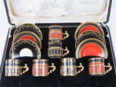 A set of six Royal Worcester coffee cans in HM silver holders in original box with saucers.