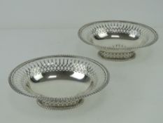 A pair of Victorian HM silver bonbon dishes having pierced decoration to rim and to single footed