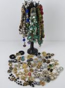 A jewellery stand in the form of a leopard print female mannequin together with a quantity of
