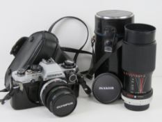 An Olympus CM10 camera in original case with Hoya 49mm lens.