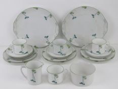 A part tea set, cream ground with transfer printed floral decoration comprising two cake plates,