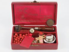 A vintage 'Georgian sealing set' inc wax beads, seal, pourer etc, all within leatherette box.