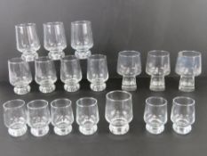 A quantity of assorted contemporary footed glass tumblers.
