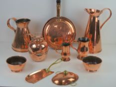 A good clean quantity of assorted copper ware including; jugs, bowls, flagons, crumb scoop,