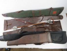 A vintage leather 'leg of mutton' gun case,