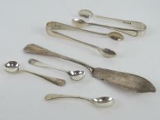 Two pairs of HM silver sugar tongs together with a pair of HM silver salt spoons,