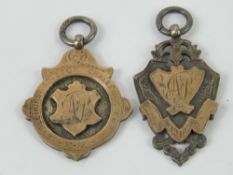 Two HM silver and rose metal medallions, each hallmarked for Birmingham.