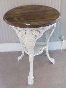 A cast iron and painted tripod Britannia table with circular mahogany top, 59cm dia, 72 high.