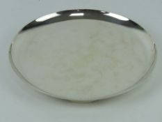 An Art Deco HM silver salver of circular form raised over three feet,