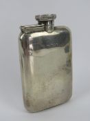 An HM silver hip flask having hinged screw cap lid, hallmarked London 1940,
