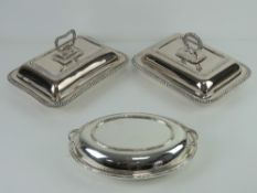 Three assorted silver plated lidded tureens, two square shaped, one oval.