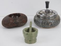 A c1960s 'spinning' smokers receptacle, a scalloped and polished serpentine smokers receptacle,