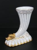 A cream ground and gilded Coalport cornucopia vase.