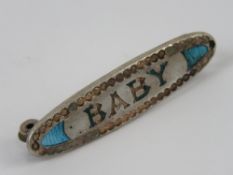 An enamelled Charles Horner 'Baby' Art Nouveau silver brooch,