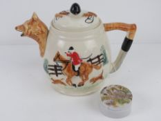 A hunting-themed teapot having fox head spout with huntsman on horseback decoration upon,