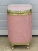 A Loom style blush pink and gilded laundry bin. 37 x 32 x 62.
