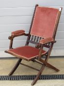 A part upholstered folding Campaign chair.