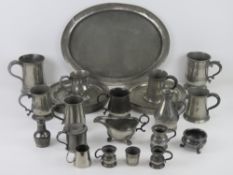 A large quantity of assorted 19th century and later pewter including; flagons, peppers,